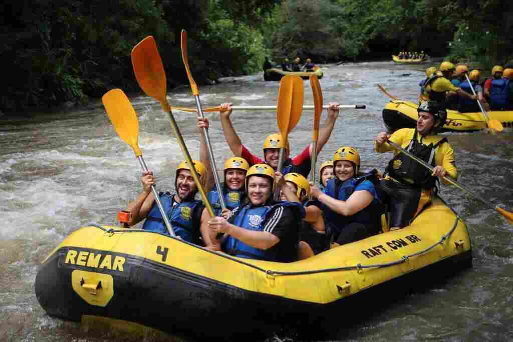 Happy customers doing rafting.